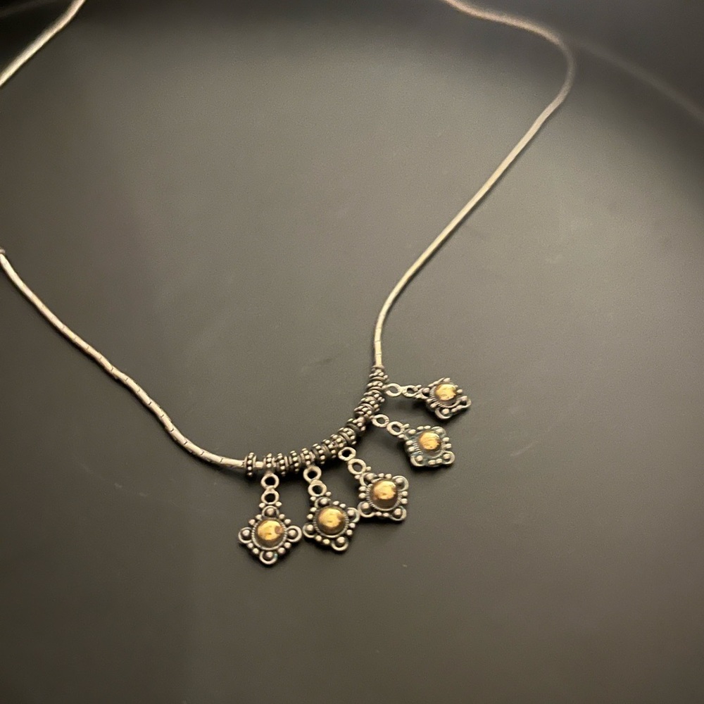 Elegant Silver Tone Necklace with Intricate Detailing